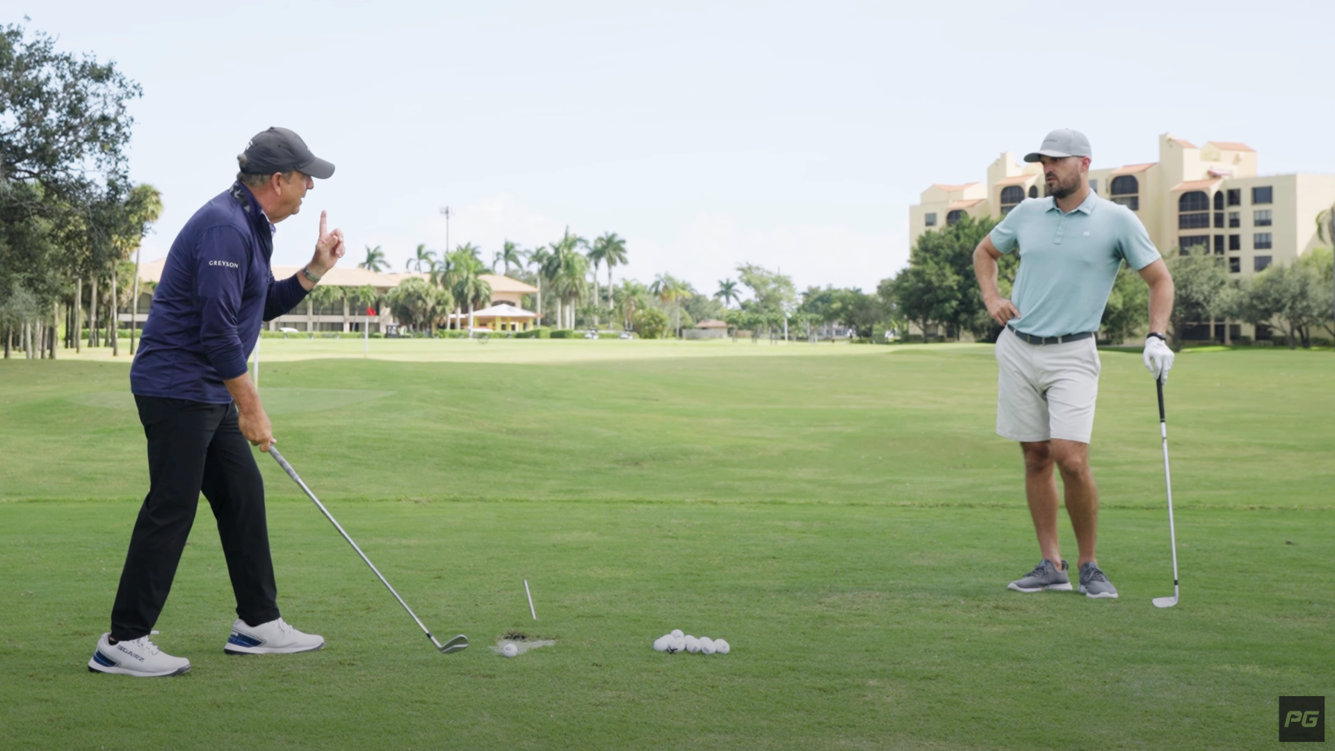 Two golfers talking to each other